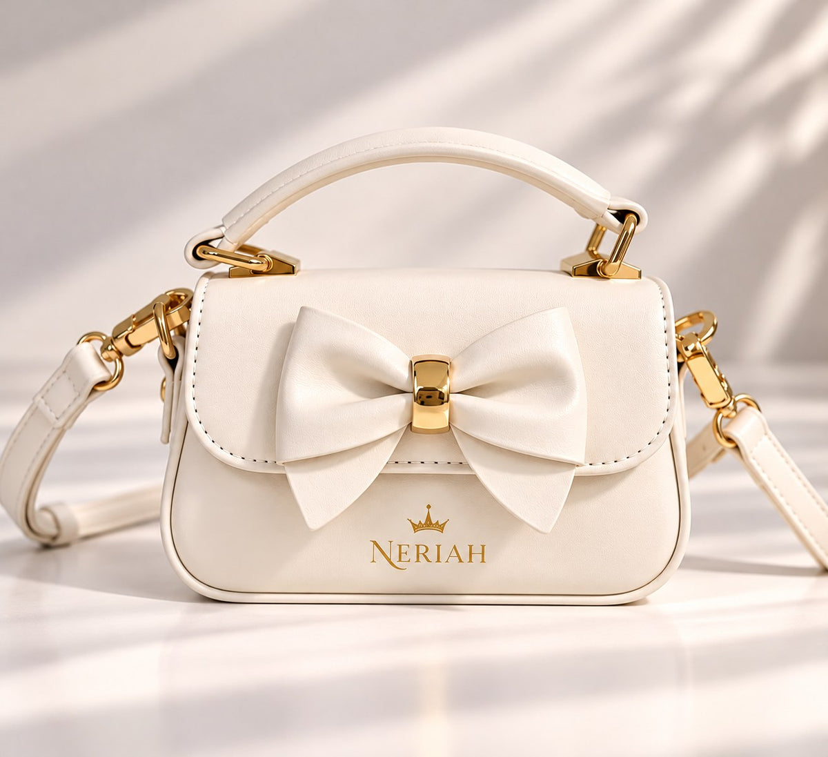 Ivory NERIAH Bow Bag with gold hardware