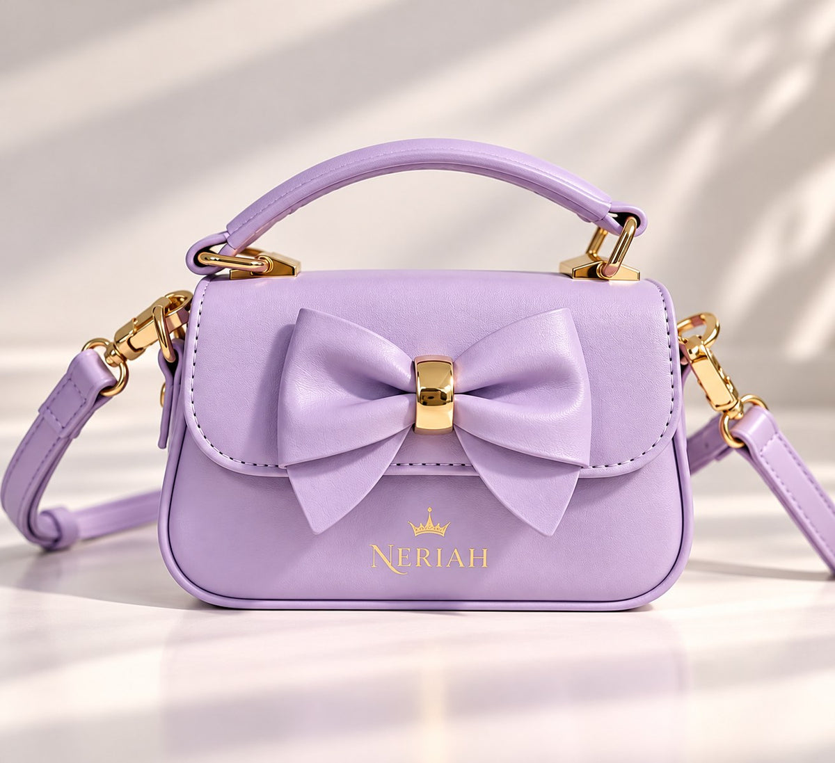 Lavender NERIAH Bow Bag with gold hardware